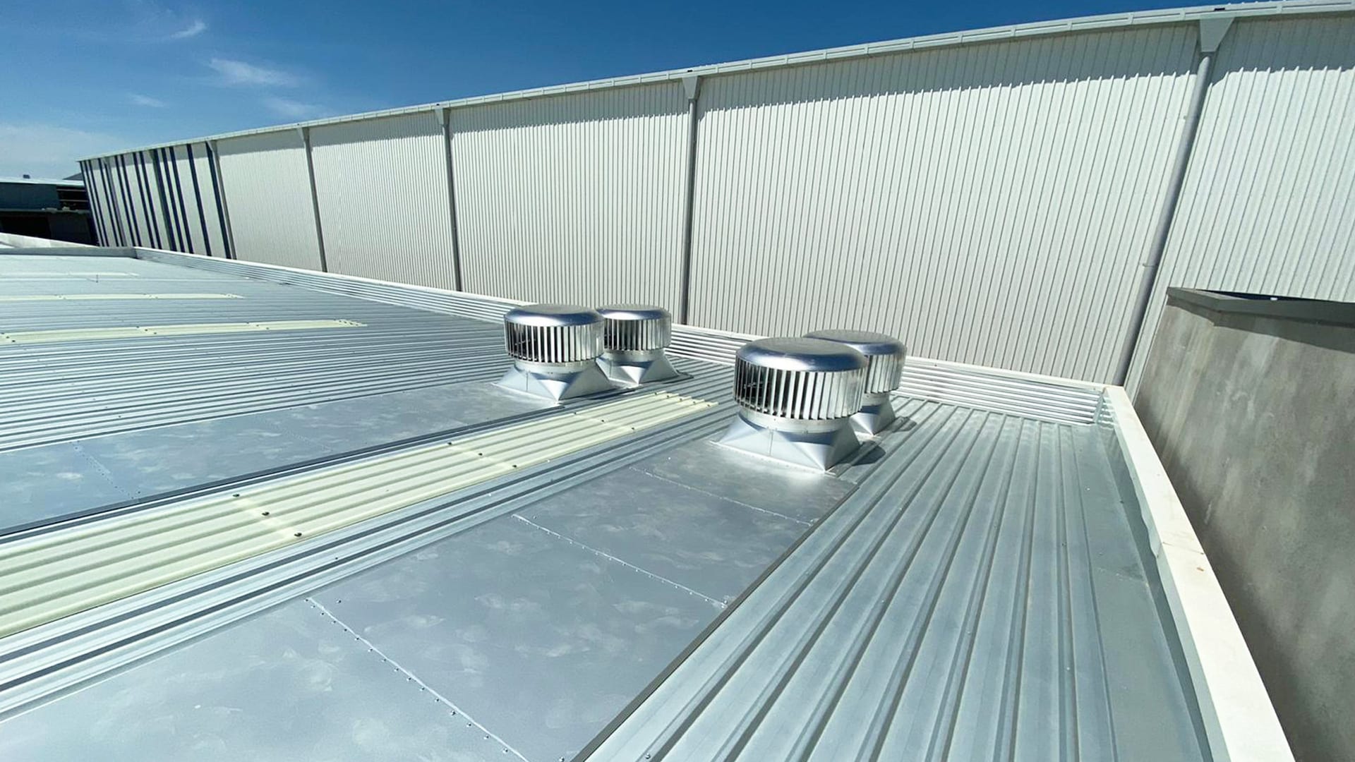 Rotary Vents with Back Trays on Warehouse Roof